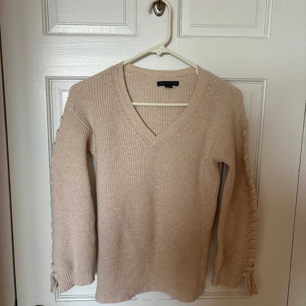 American Eagle Cream Sweater with braids down sleeves